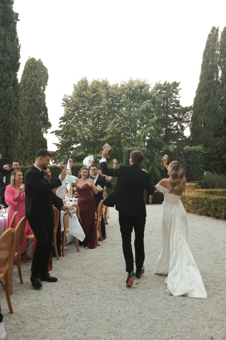 Ana and Silviu dancing in as guests wave napkins