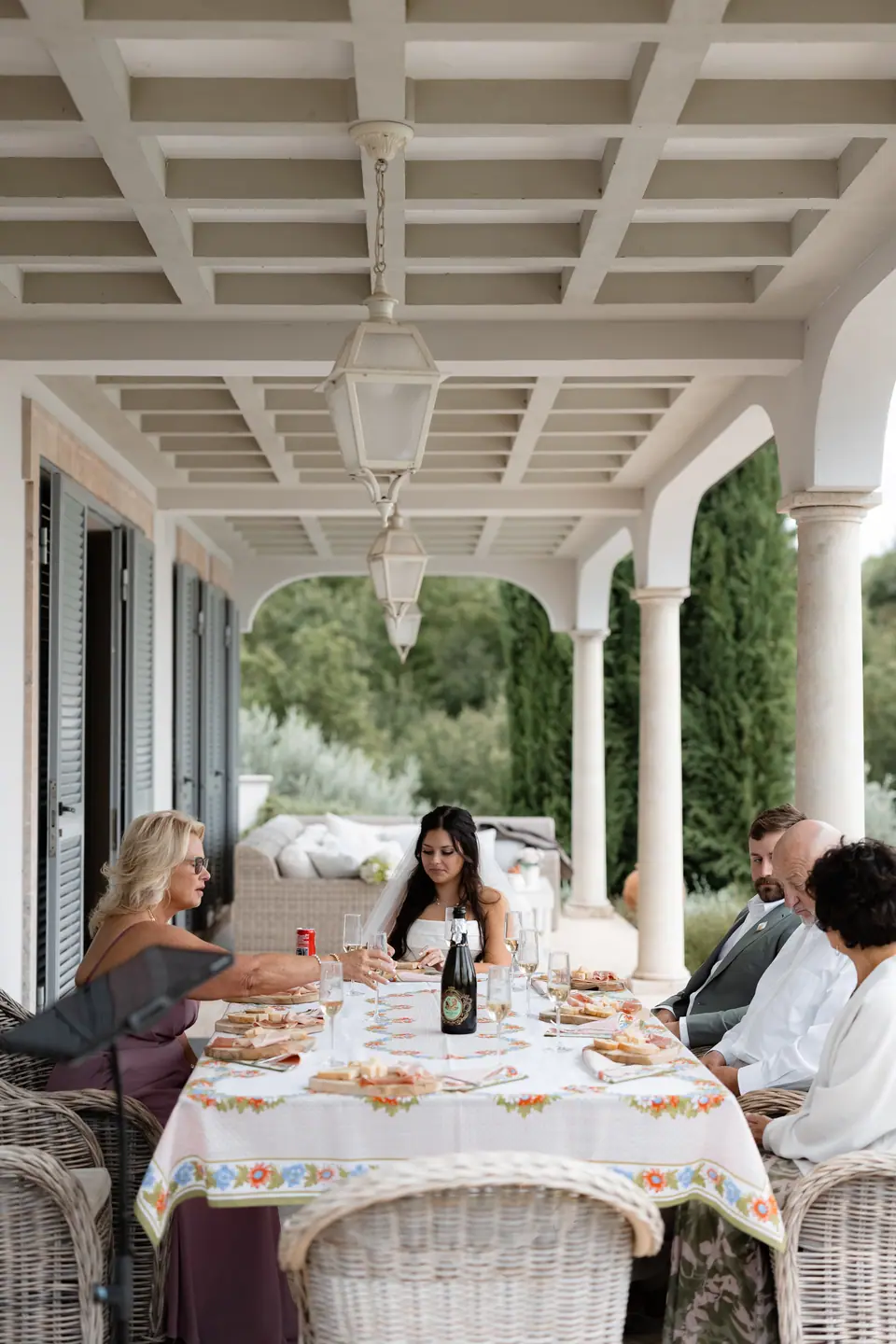 Haley, Zach and their families at lunch under the villa’s covered terrace
