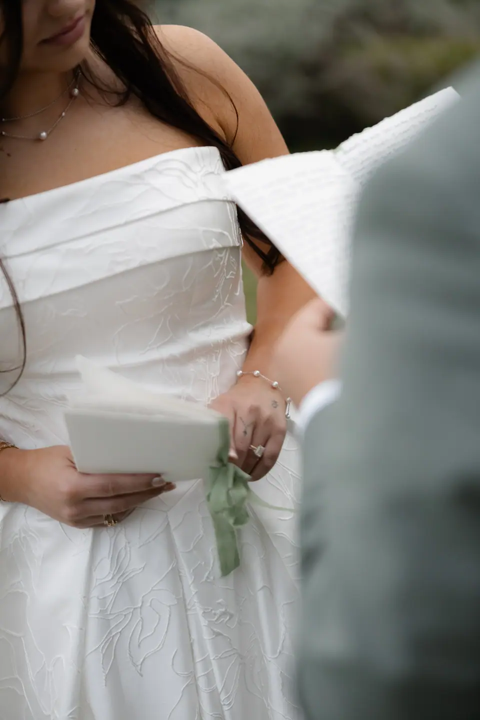 Haley holding her letter with its green ribbon, Zach beside her