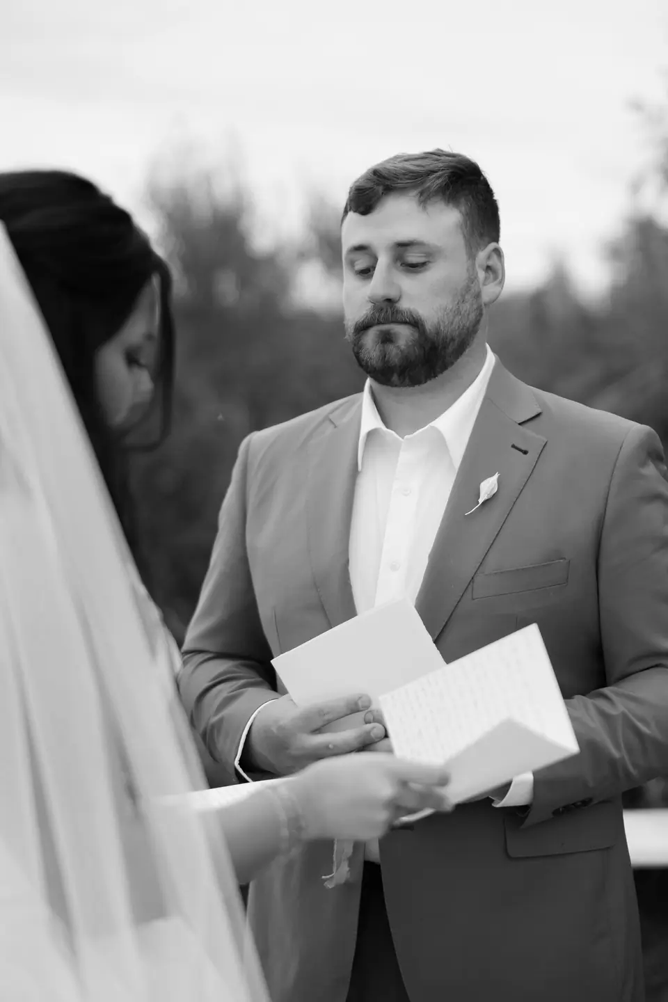 Black and white photograph of Zach reading Haley’s letter