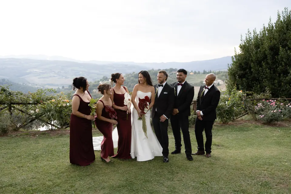 Sivitha and Rory with their bridesmaids and groomsmen on the lawn