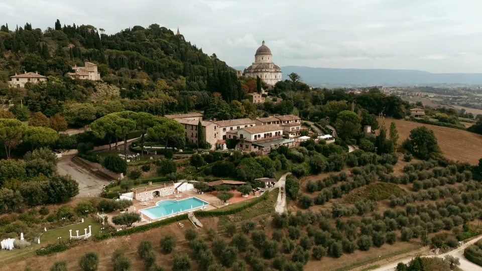 An aerial view of Monastero Santa Margherita among olive groves near Todi