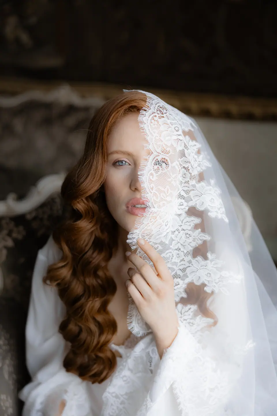 Roberta looking out from beneath a lace veil