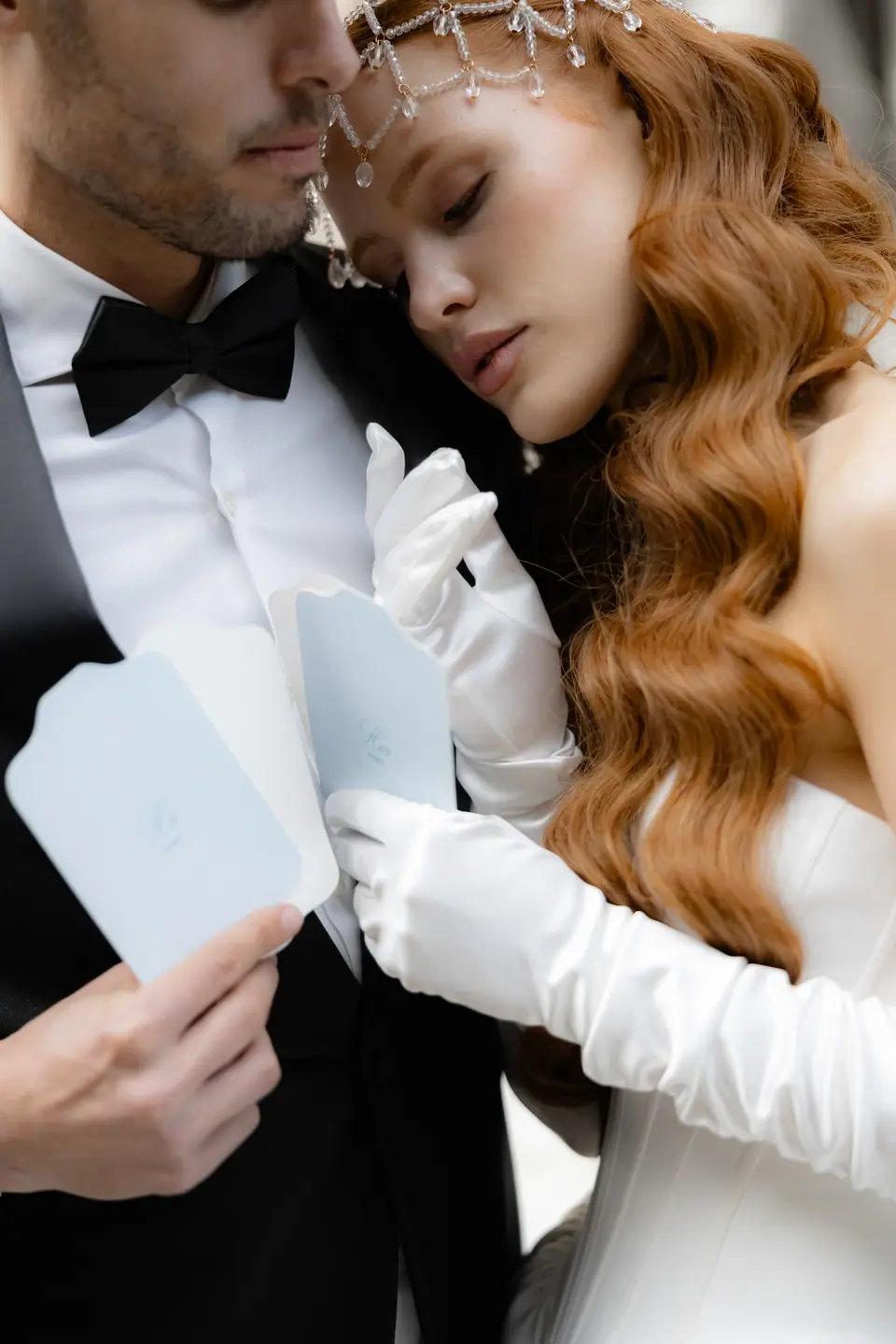 Antoine holding Roberta close as she leans into him in long white gloves